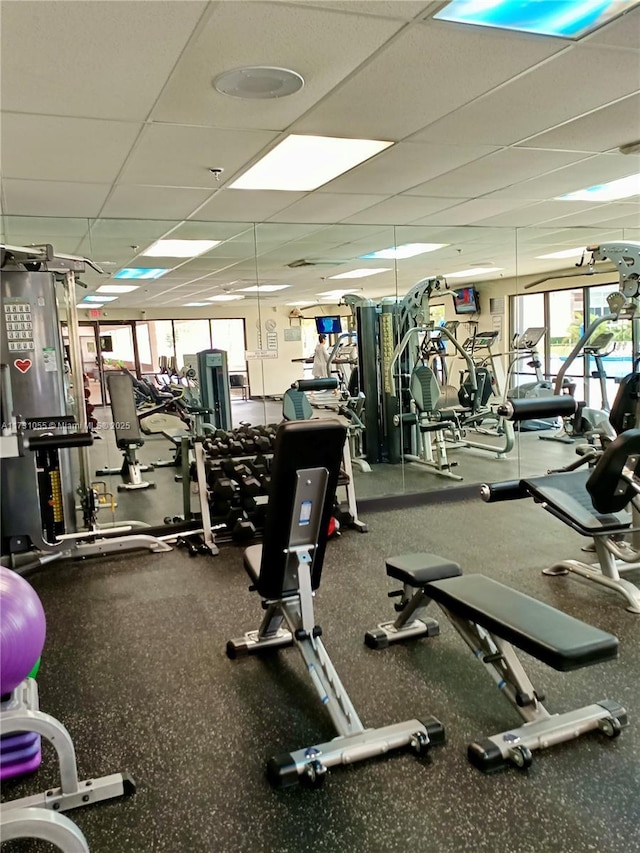 workout area with a paneled ceiling