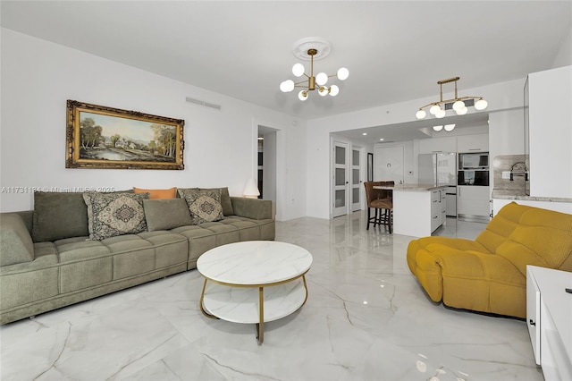 living room with a notable chandelier