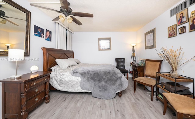 bedroom featuring ceiling fan and light wood-type flooring