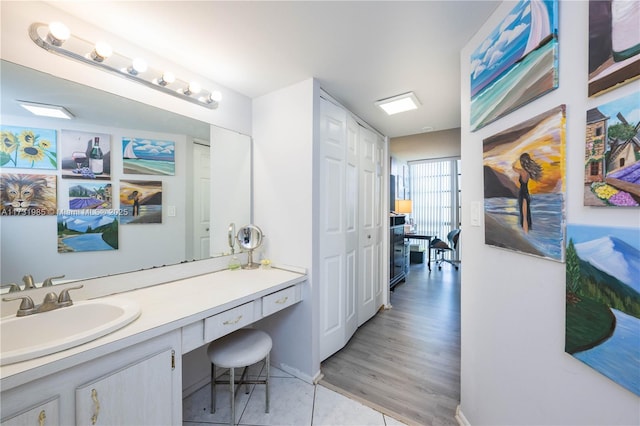 bathroom with vanity and wood-type flooring