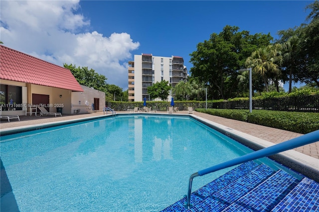 view of swimming pool featuring a patio