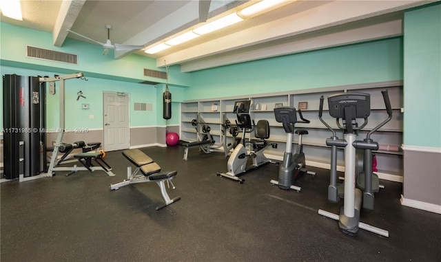 exercise room with ceiling fan