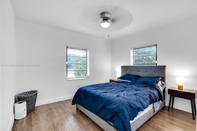 bedroom featuring ceiling fan and hardwood / wood-style floors