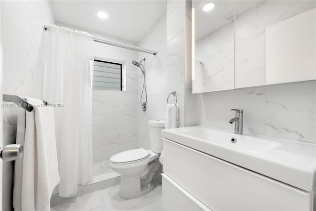 bathroom featuring vanity, toilet, and tiled shower