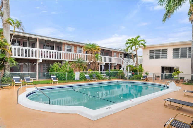 view of swimming pool featuring a patio area