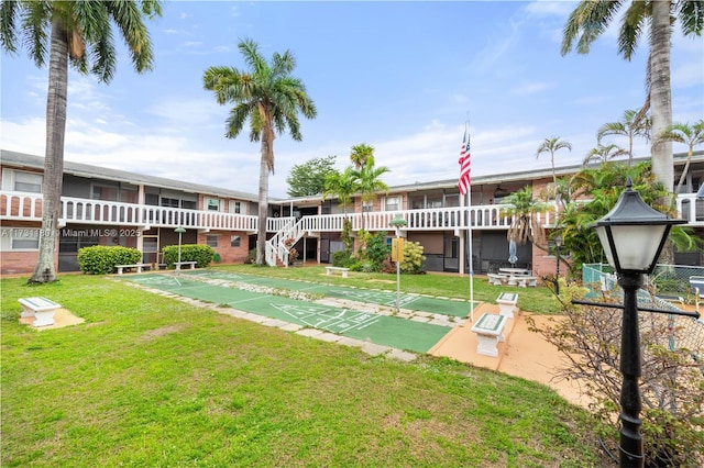 view of community featuring a lawn