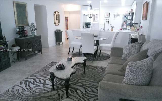 living room featuring a notable chandelier