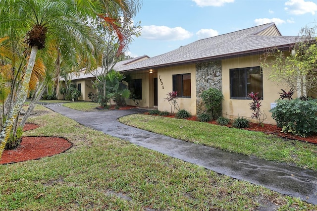 view of front of property with a front lawn