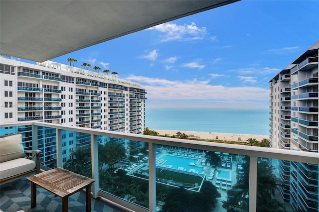 balcony with a beach view and a water view