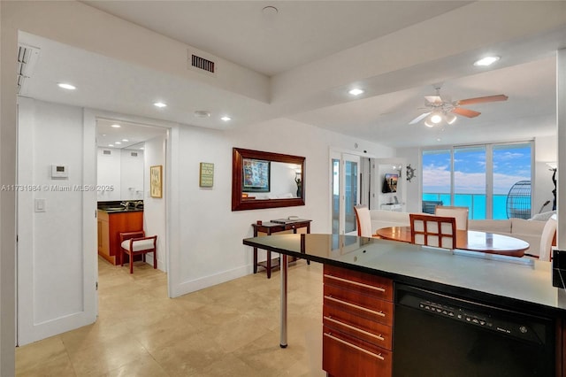 kitchen with expansive windows, ceiling fan, and black dishwasher