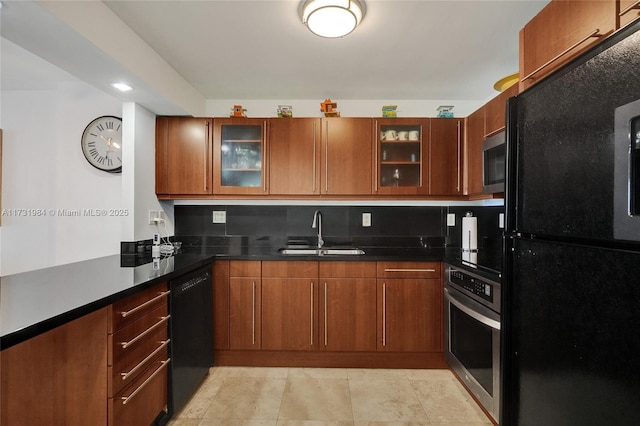 kitchen with tasteful backsplash, sink, and black appliances