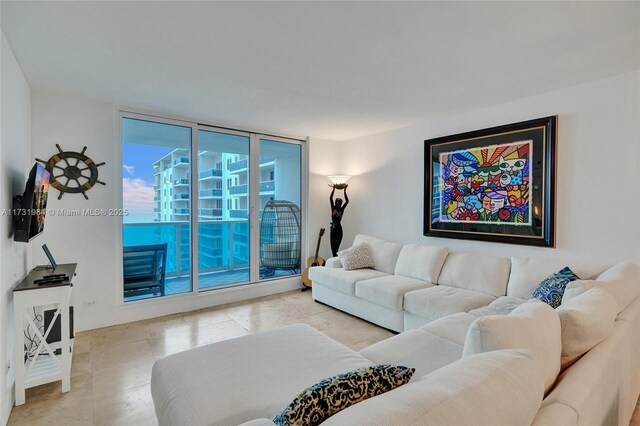 living room with floor to ceiling windows