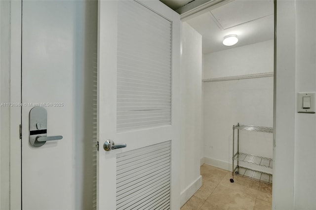 bathroom with tile patterned floors