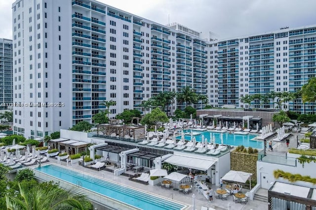 view of pool with a pergola and a patio