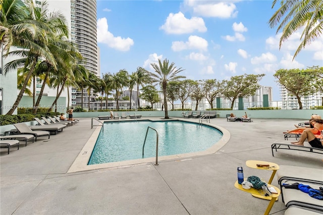 view of swimming pool featuring a patio area