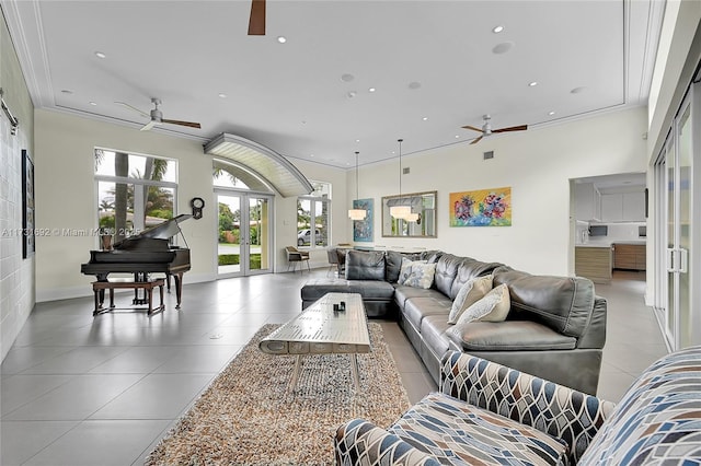 living room with ornamental molding, french doors, and ceiling fan