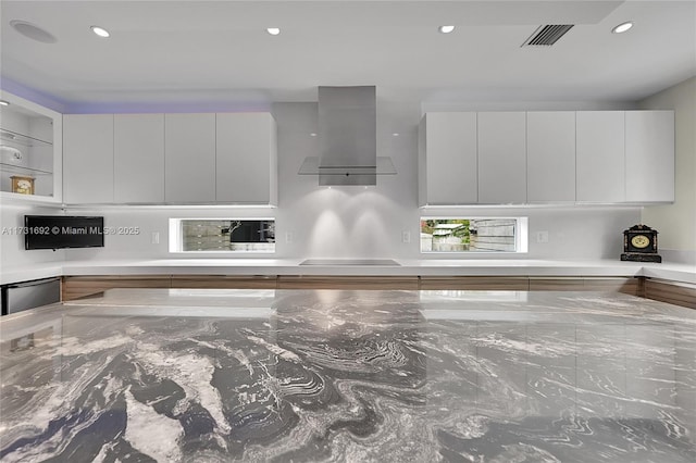 interior details with black electric cooktop, dishwasher, and island exhaust hood