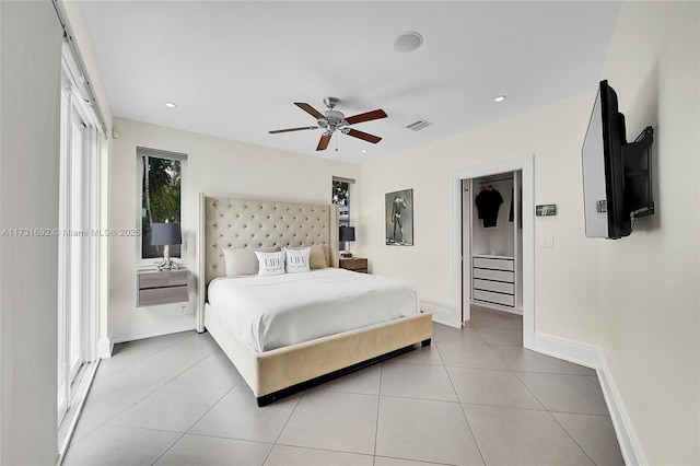 bedroom with ceiling fan and light tile patterned floors