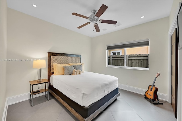 tiled bedroom featuring ceiling fan