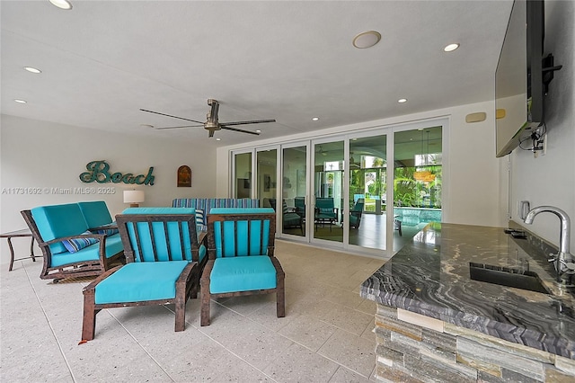 view of patio featuring sink and ceiling fan