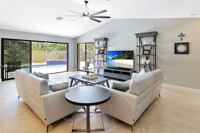 living room with lofted ceiling, light tile patterned floors, and ceiling fan