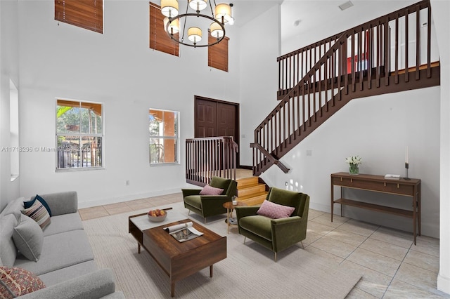 tiled foyer entrance featuring a high ceiling and a chandelier