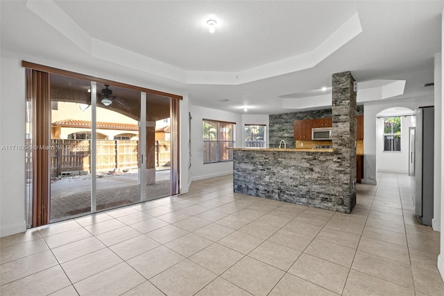 spare room featuring ceiling fan and hardwood / wood-style floors