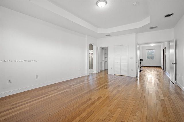 spare room with light hardwood / wood-style flooring