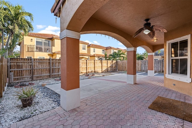 view of patio featuring ceiling fan