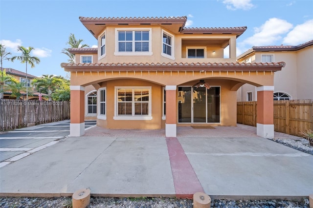 back of house with a patio