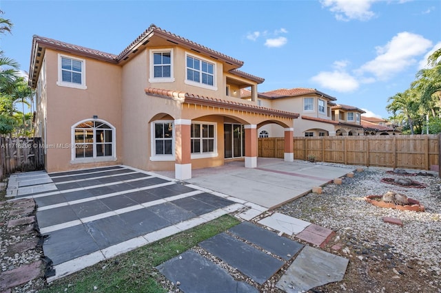 rear view of property featuring a patio