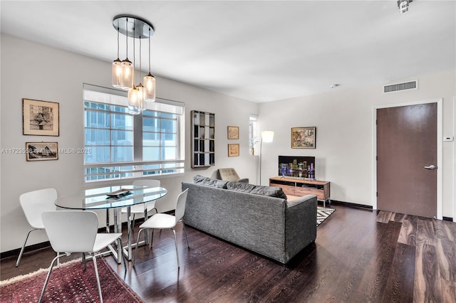 living room featuring dark hardwood / wood-style floors