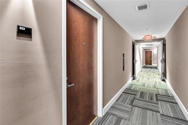 hallway featuring carpet floors