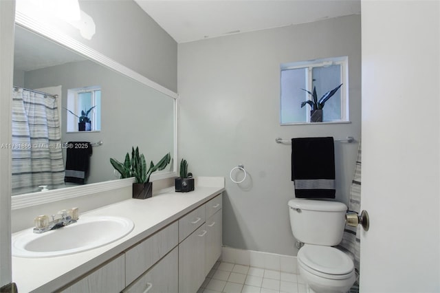 bathroom featuring vanity, tile patterned floors, and toilet