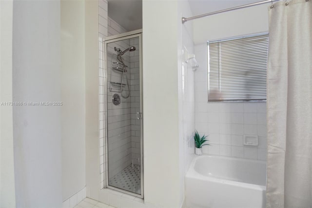 bathroom with tile patterned floors and independent shower and bath