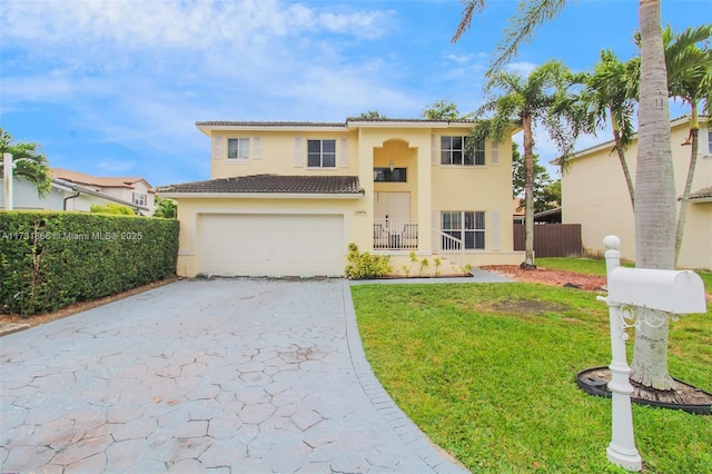 view of front of house with a garage and a front lawn