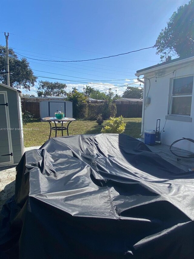 view of patio featuring a storage unit and outdoor lounge area