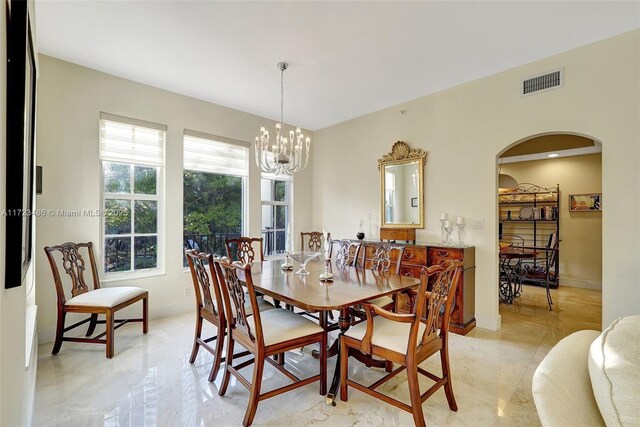 dining space with a chandelier