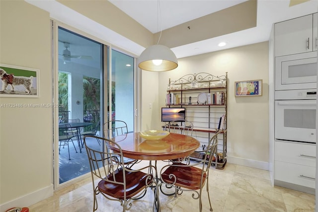 dining room featuring ceiling fan