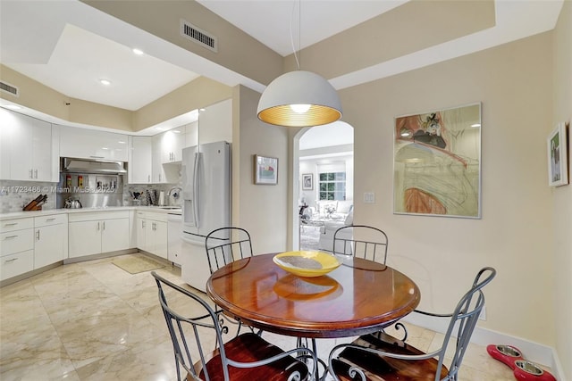 dining space featuring sink