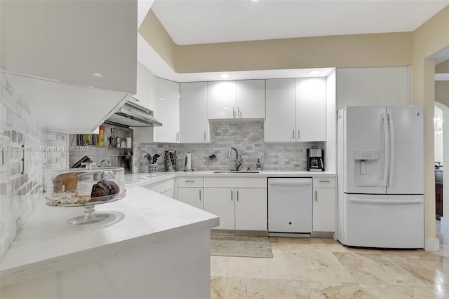 kitchen featuring white cabinetry, sink, white appliances, and backsplash