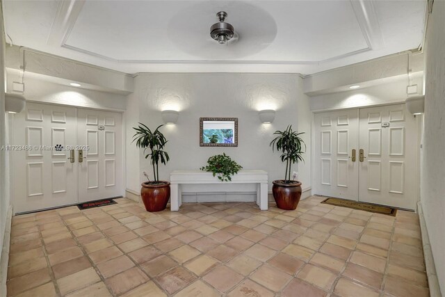 entryway featuring a raised ceiling