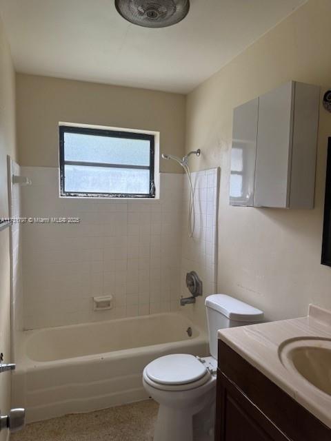 full bathroom with vanity, toilet, and tiled shower / bath