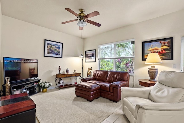 living room featuring light tile patterned floors and ceiling fan