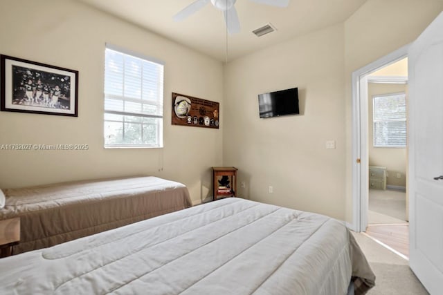 carpeted bedroom with ceiling fan