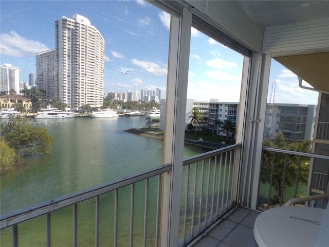 balcony featuring a water view