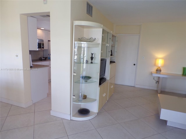 bathroom featuring tile patterned flooring