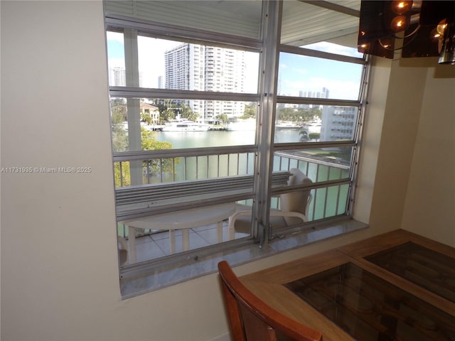 interior space featuring an inviting chandelier and a water view