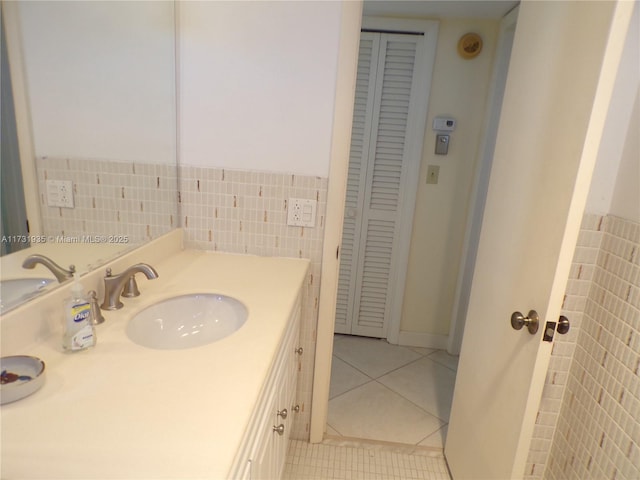 bathroom featuring tile walls, vanity, and tile patterned floors