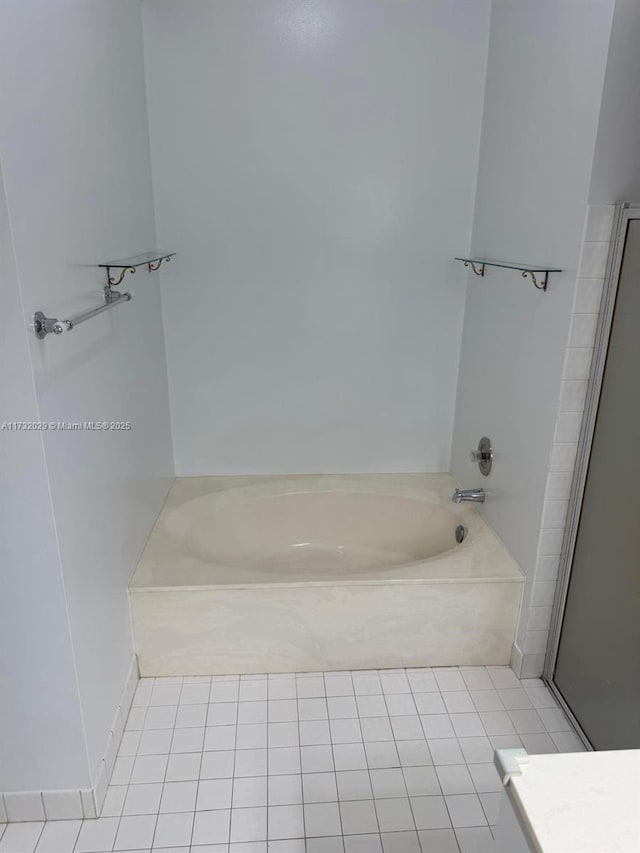 bathroom featuring tile patterned floors and a bathing tub